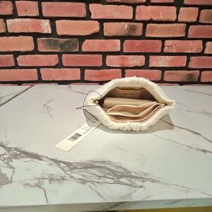 Loeffler Randall Cream Wristlet with Soft Rounded Shape